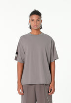 Camiseta Relaxed Fit con manga caída y X de cordones cruzados | MWM [PS_COLORS:GREY]
