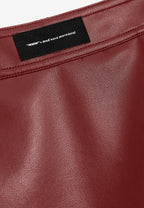Minifalda de efecto piel con apertura frontal y tachuelas metálicas | MWM [PS_COLORS:BURGUNDY]