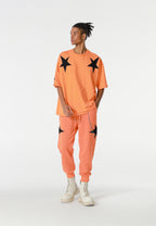 Camiseta Wings de corte relajado con estrellas frontales y doble parche de alas en la espalda | MWM [PS_COLORS:ORANGE]