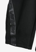 Pantalón barrel con cintas asimétricas MWM y bajos ajustables | MWM [PS_COLORS:BLACK]