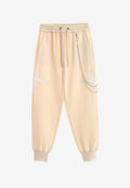 Pantalón jogger Wings con parches de estrellas y cadena lateral | MWM [PS_COLORS:BEIGE]