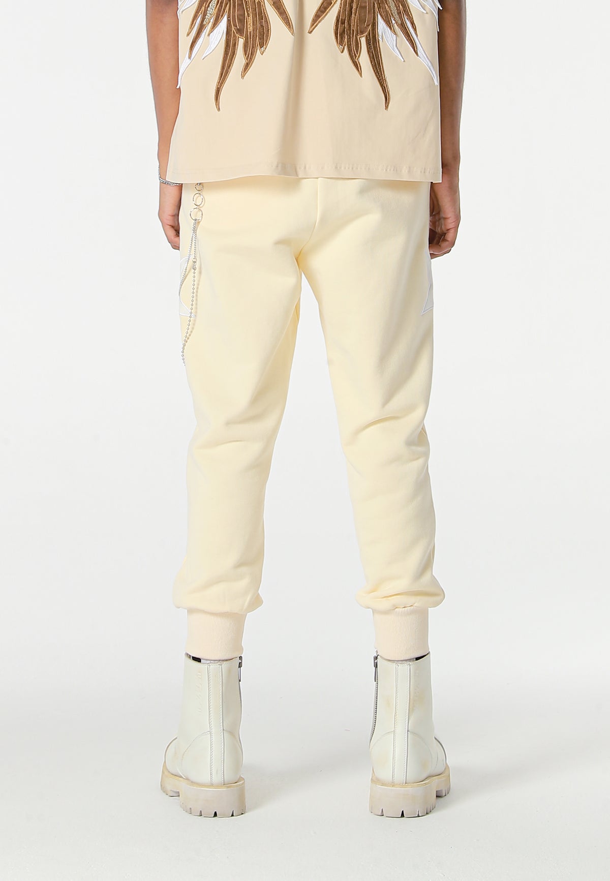 Pantalón jogger Wings con parches de estrellas y cadena lateral | MWM [PS_COLORS:BEIGE]