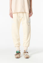 Pantalón jogger Wings con parches de estrellas y cadena lateral | MWM [PS_COLORS:BEIGE]