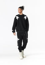 Pantalón jogger Wings con parches de estrellas y cadena lateral | MWM [PS_COLORS:BLACK]