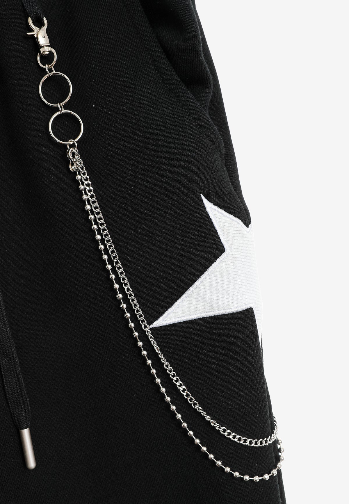 Pantalón jogger Wings con parches de estrellas y cadena lateral | MWM [PS_COLORS:BLACK]