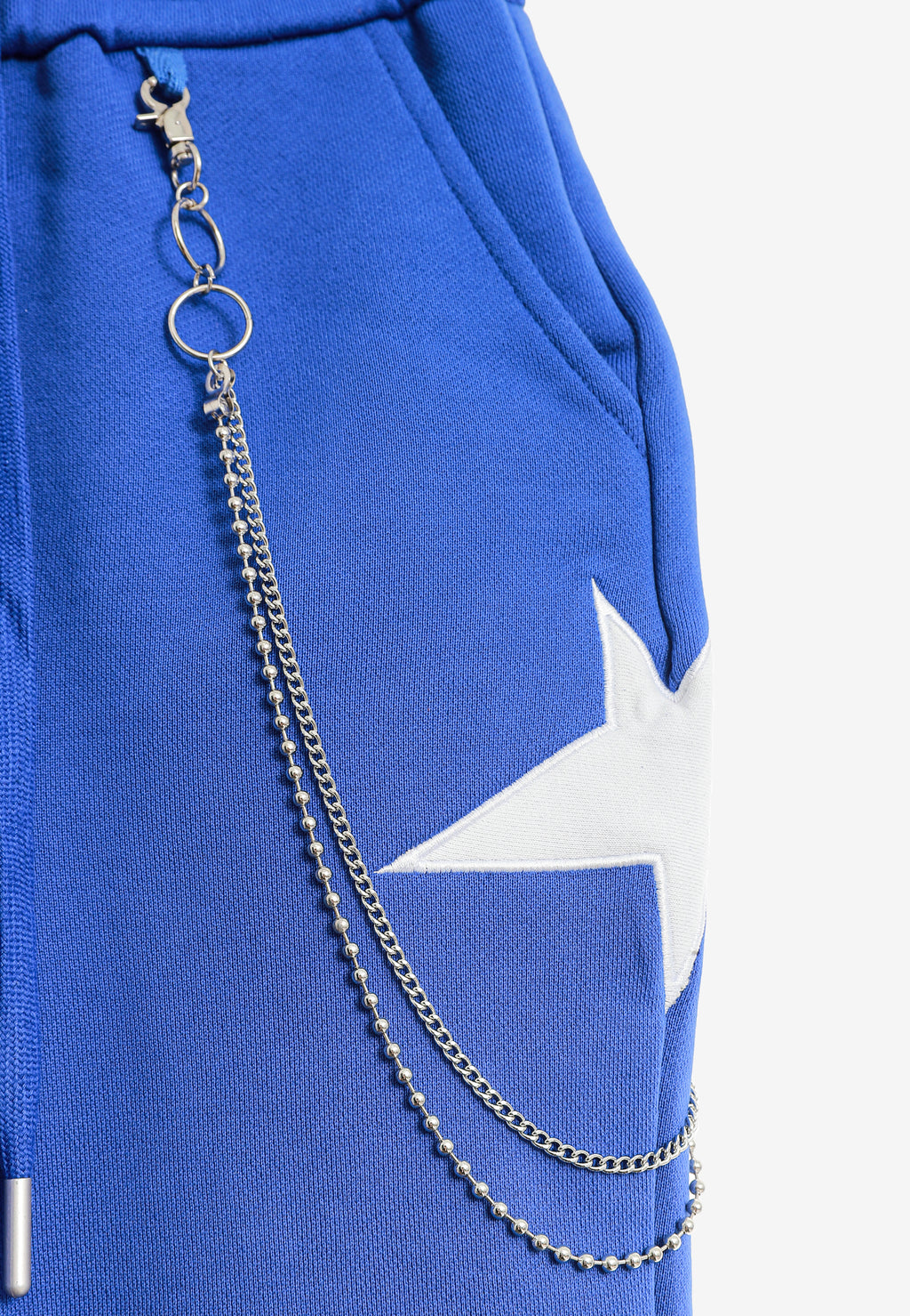 Pantalón jogger Wings con parches de estrellas y cadena lateral | MWM [PS_COLORS:BLUE]