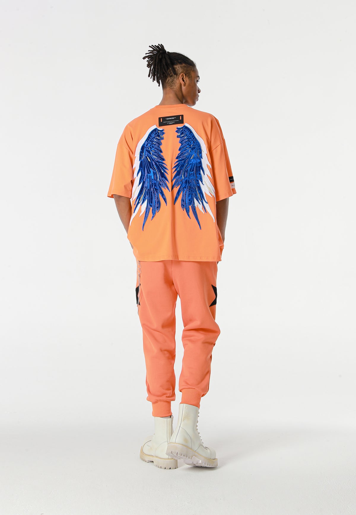 Pantalón jogger Wings con parches de estrellas y cadena lateral | MWM [PS_COLORS:ORANGE]