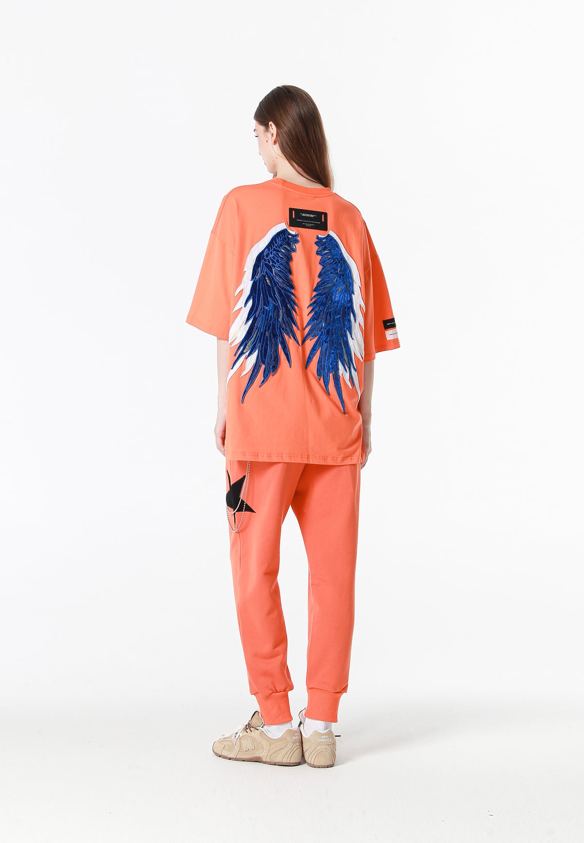 Pantalón jogger Wings con parches de estrellas y cadena lateral | MWM [PS_COLORS:ORANGE]