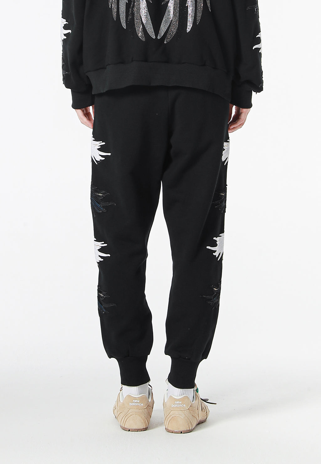 Pantalón jogger Wings con parches Mini Wings en los laterales | MWM [PS_COLORS:BLACK]