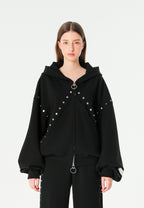 Sudadera con capucha, cremallera frontal, mangas globo y tachuelas metálicas | MWM [PS_COLORS:BLACK]