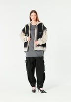 Chaqueta multicapa con capucha, cremallera y paneles superpuestos | MWM [PS_COLORS:BLACK]