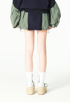 Falda efecto globo con paneles técnicos y bolsillos laterales | MWM [PS_COLORS:NAVY/GREEN]