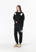 Sudadera Wings de corte relajado con estrellas frontales y doble parche de alas en la espalda | MWM [PS_COLORS:BLACK]