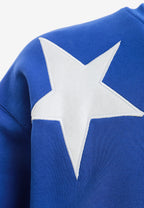 Sudadera Wings de corte relajado con estrellas frontales y doble parche de alas en la espalda | MWM [PS_COLORS:BLUE]