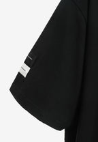 Camiseta de corte relajado con diseño entrelazado y tachuelas en los hombros | MWM [PS_COLORS:BLACK]