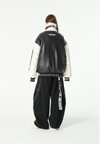Chaqueta Iconic Logos efecto piel colorblock con cuello alto y cuatro bolsillos | MWM [PS_COLORS:BLACK]