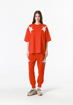 Pantalón jogger Wings con parches de estrellas y cadena lateral | MWM [PS_COLORS:RED]