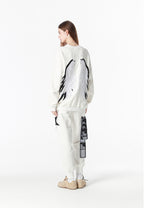 Pantalón jogger Wings con parches de estrellas y cadena lateral | MWM [PS_COLORS:WHITE]
