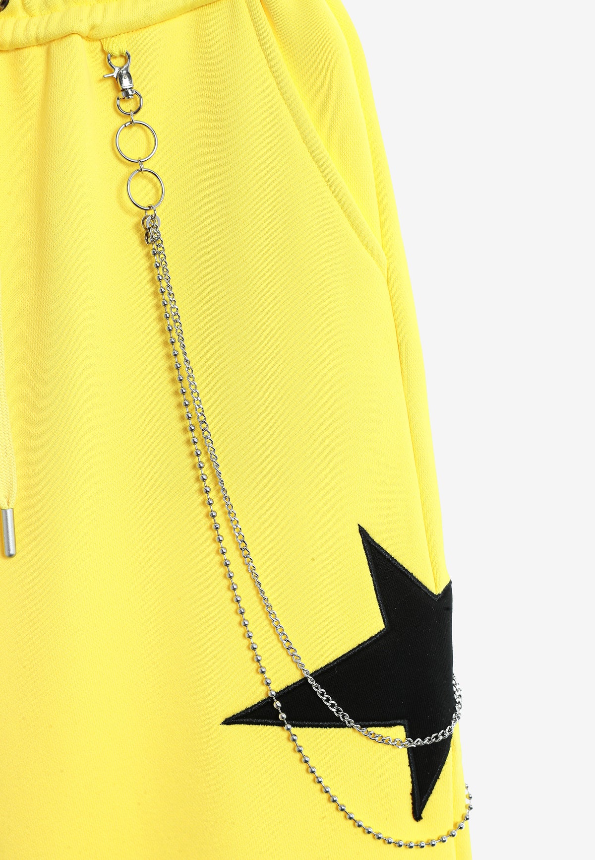 Pantalón jogger Wings con parches de estrellas y cadena lateral | MWM [PS_COLORS:YELLOW]