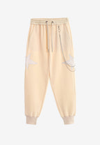 Pantalón jogger de niño Wings con parches de estrellas y cadena lateral | MWM [PS_COLORS:BEIGE]