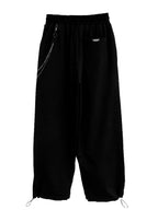 TROUSERS WITH CHAIN